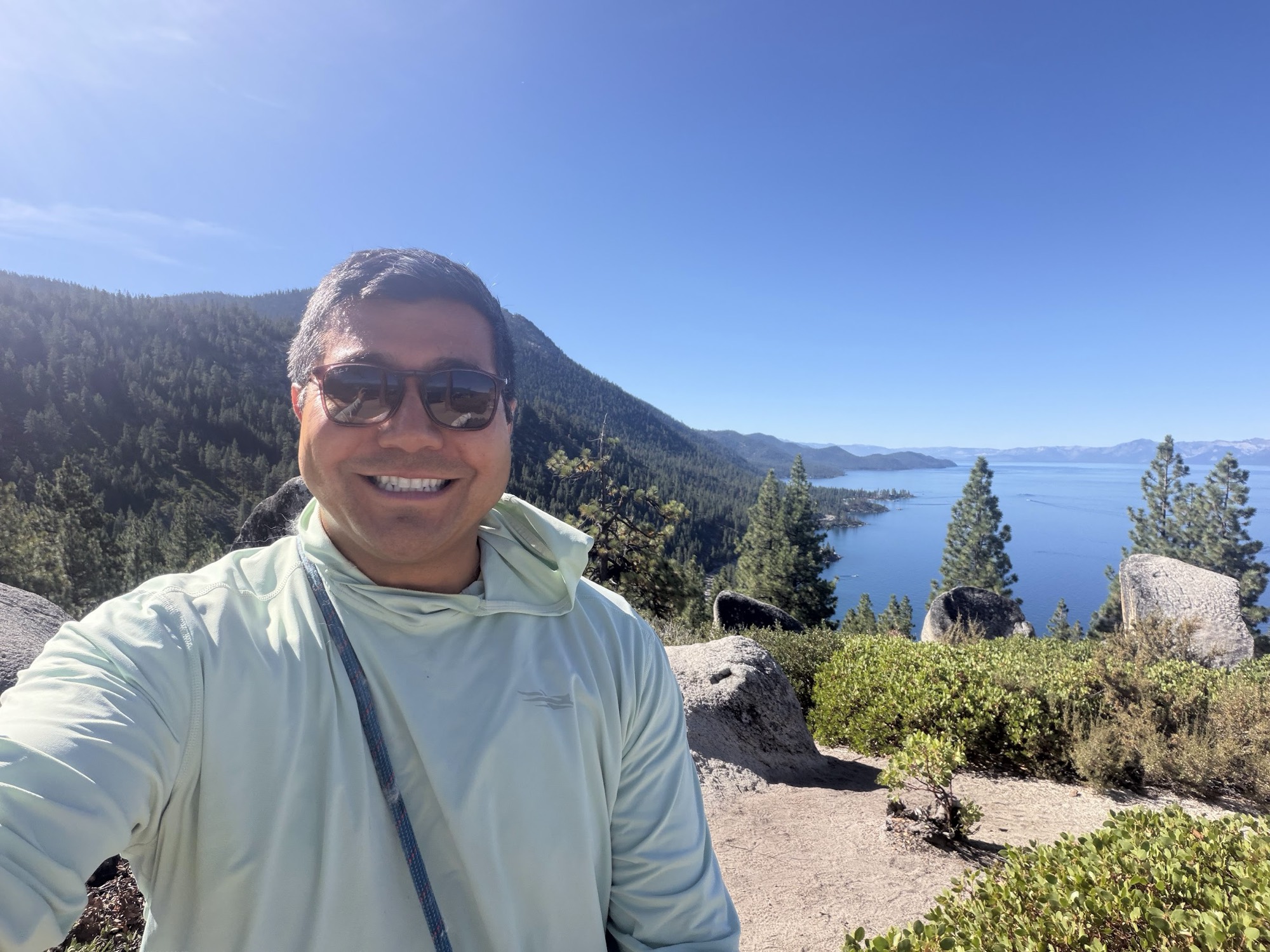 Rob Roderick (Robert Roderick) smiling at an overlook above Lake Tahoe